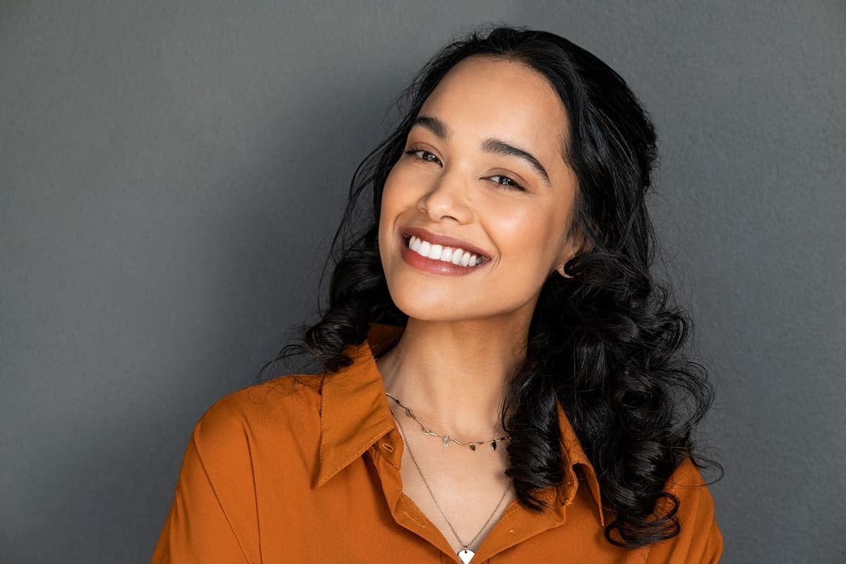 Woman smiling after cosmetic dental bonding