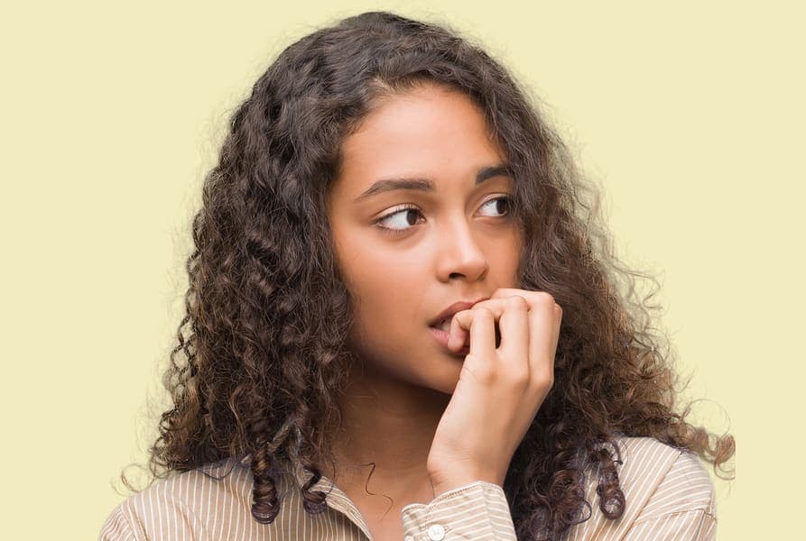 Person biting their fingernails