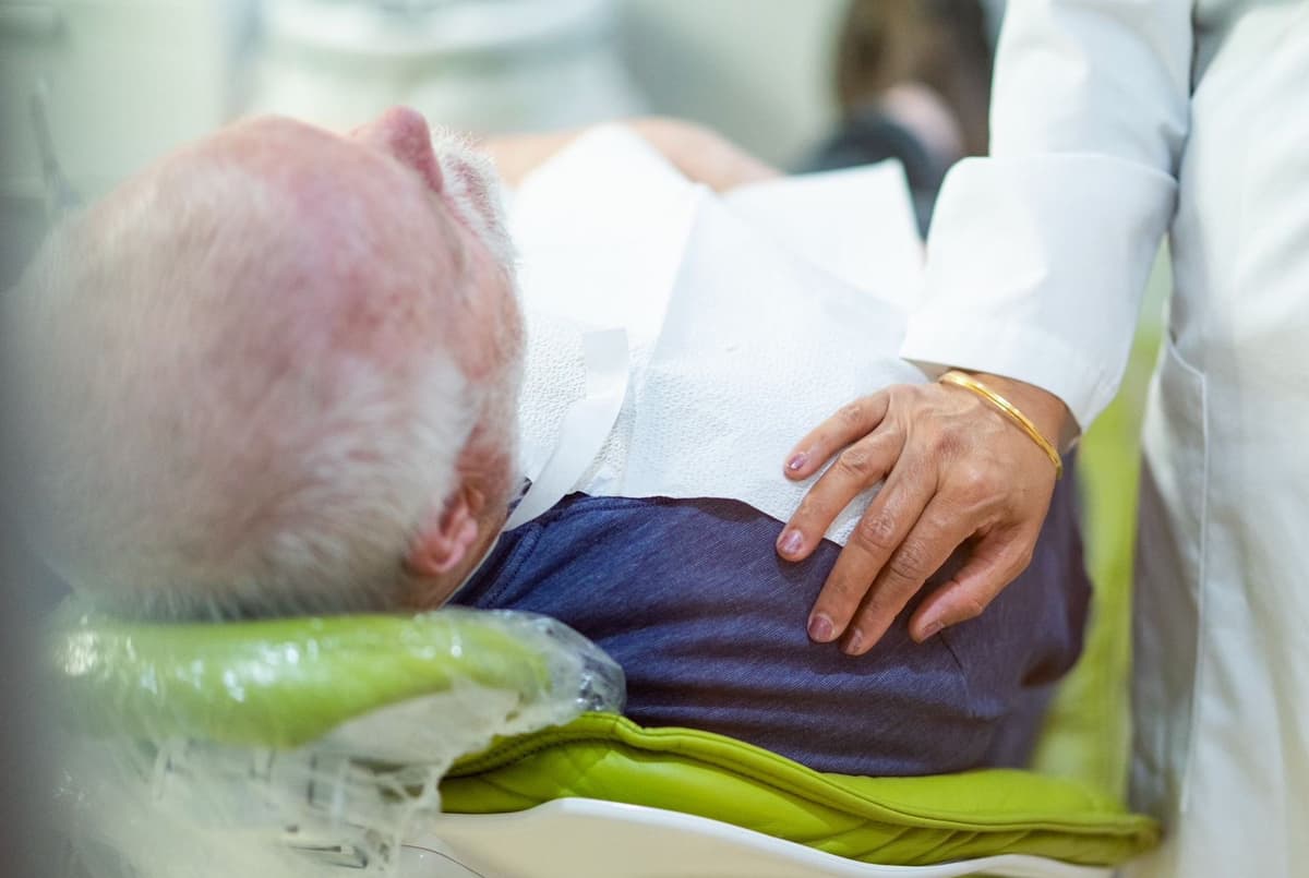 Dr. Talwar providing compassionate patient care at Advanced Dental Care