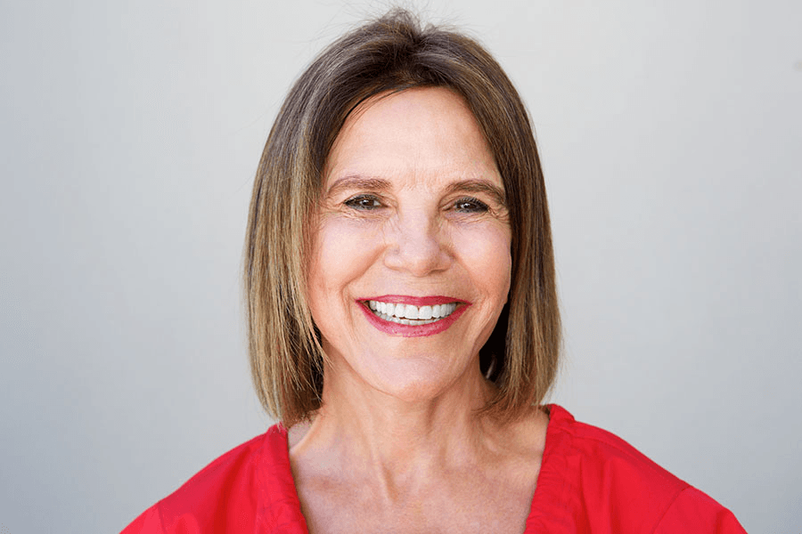 Woman with brunette bob smiling confidently after smile makeover at Advanced Dental Care Leesburg
